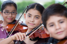 Three youth playing violin